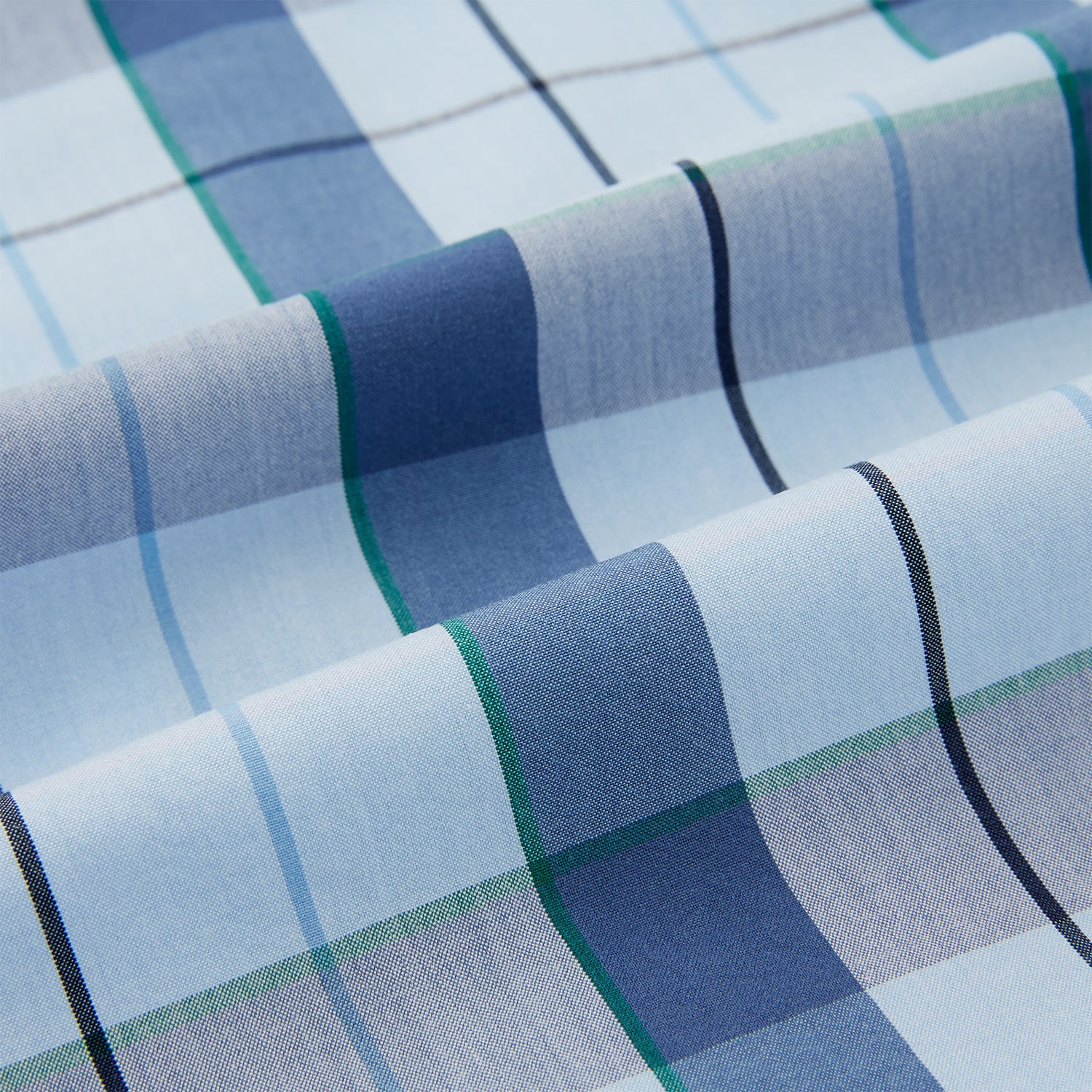 View 6 of product The Turnbull & Asser Blue Multi Check Pyjama Shirt features a blue and white check pattern, long sleeves, and a collar—an elegant loungewear option perfect for nightwear.