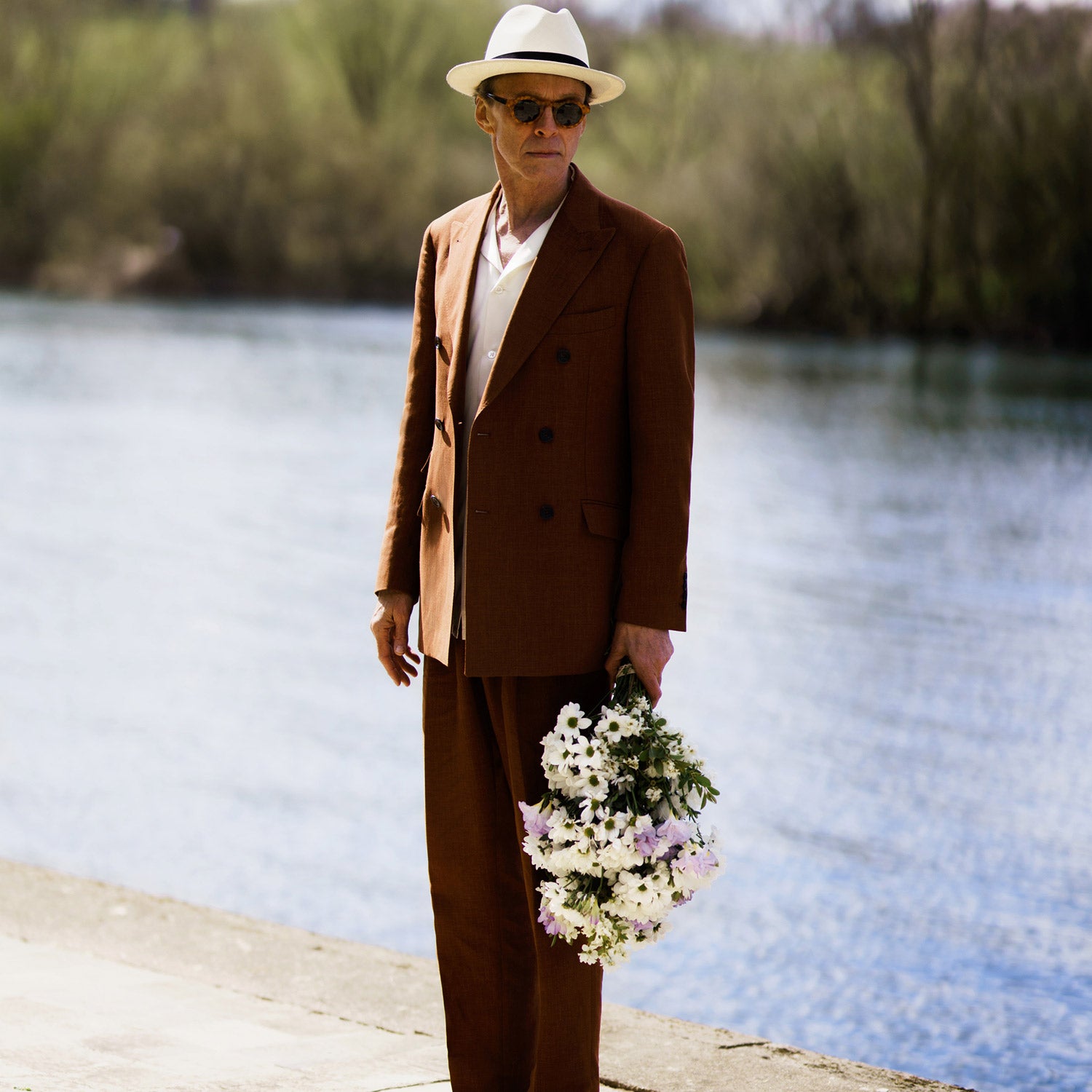 View 3 of product The Turnbull & Asser Rust Linen-Wool-Silk Bertie Blazer is a red double-breasted jacket with peak lapels, black buttons, and flap pockets, tailored in Italy from a luxury linen-wool-silk blend and shown on a white background.