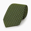 View 5 of product The Turnbull & Asser Green and Blue Micro Dot Silk Tie is shown rolled up, displaying small light blue dots on green silk against a plain white background.