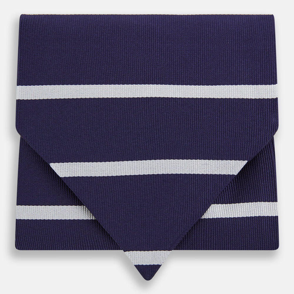 The Turnbull & Asser Silver Stripe and Navy Silk Cravat features two horizontal white stripes on navy silk, offering a sophisticated British-inspired design—ideal as a unique wedding accessory.