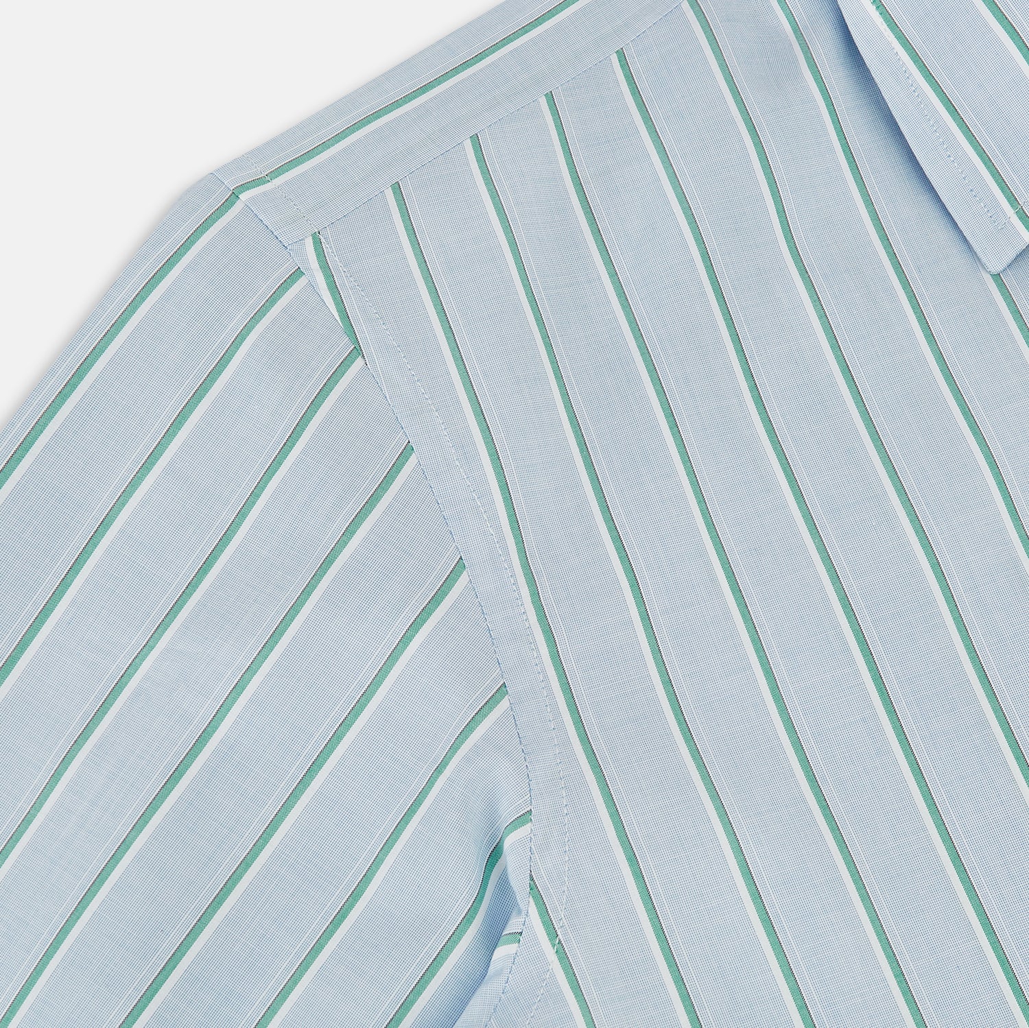 Image 6 of product Blue and green multi-stripe Westminster shirt by Turnbull & Asser, featuring a pointed collar and buttoned cuffs—a refined example of British craftsmanship on a plain white background.