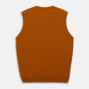 View 3 of product The Rust Ifor Slipover by Turnbull & Asser, a sleeveless V-neck in burnt orange, is made from lightweight Scottish cashmere and displayed flat on a white background.