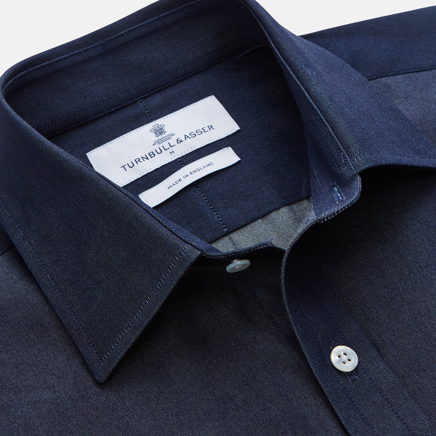 View 2 of product The Turnbull & Asser Blue Weekend Fit Finch Shirt features a Derby collar, chest pocket, classic white buttons, and timeless style, all in cotton. Laid flat on a white background.
