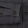 View 4 of product The Turnbull & Asser Navy Hampstead Overshirt features a collar, left chest pocket, two zippered pockets near the bottom, and a classic long-sleeve button-up design, shown laid flat on a white background.