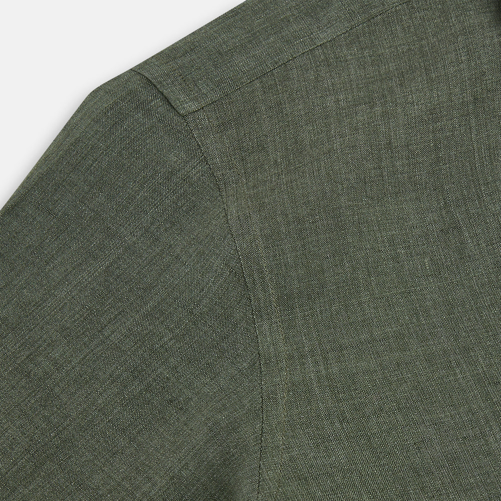 The Sage Linen Westminster Shirt by Turnbull & Asser features long sleeves, a button-up front with white buttons, a pointed Turnbull collar, and buttoned cuffs—crafted in Britain and shown here against a plain white background.