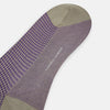 View 3 of product The Concrete Houndstooth Long Sock by Turnbull & Asser features a knee-high design with beige cuff, toe, and heel, plus a purple and black checkered pattern, shown on a plain white background.