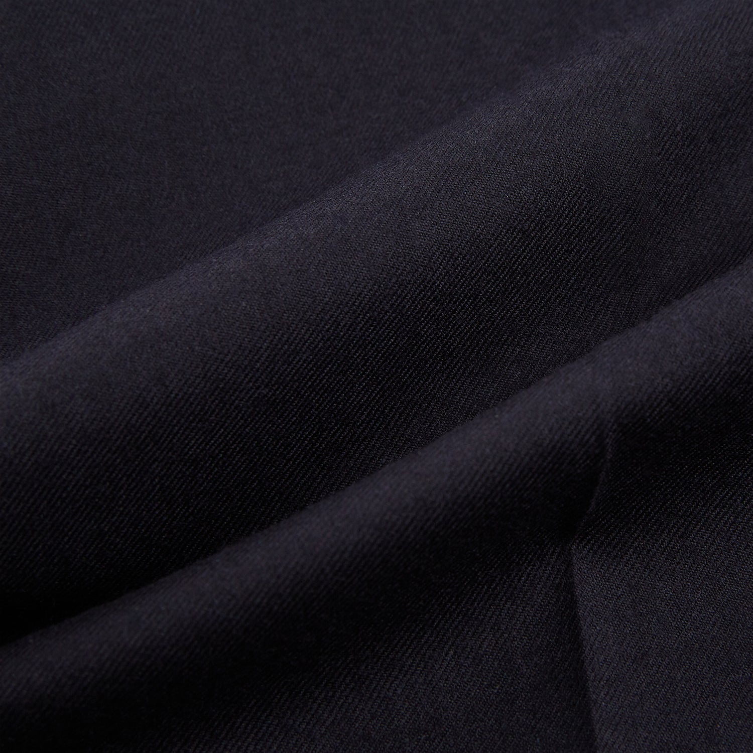 View 10 of product The Turnbull & Asser Short Navy Single Breasted Suit is shown flat on a white background, with a notch lapel jacket featuring two front pockets and matching trousers neatly folded underneath.