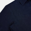 View 6 of product The Navy Linen Westminster Shirt by Turnbull & Asser features a classic collar and buttoned cuffs, exemplifying British craftsmanship. Shown here in long sleeves, the shirt is displayed flat against a white background.
