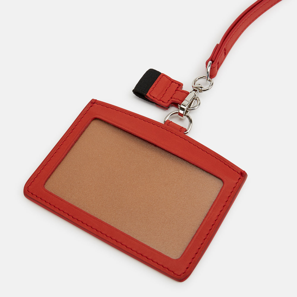 The Red ID Card Holder by Turnbull & Asser is crafted from Italian leather with a matching lanyard and a small key charm. The brand’s name is embossed in white on the front for an elegant finish.