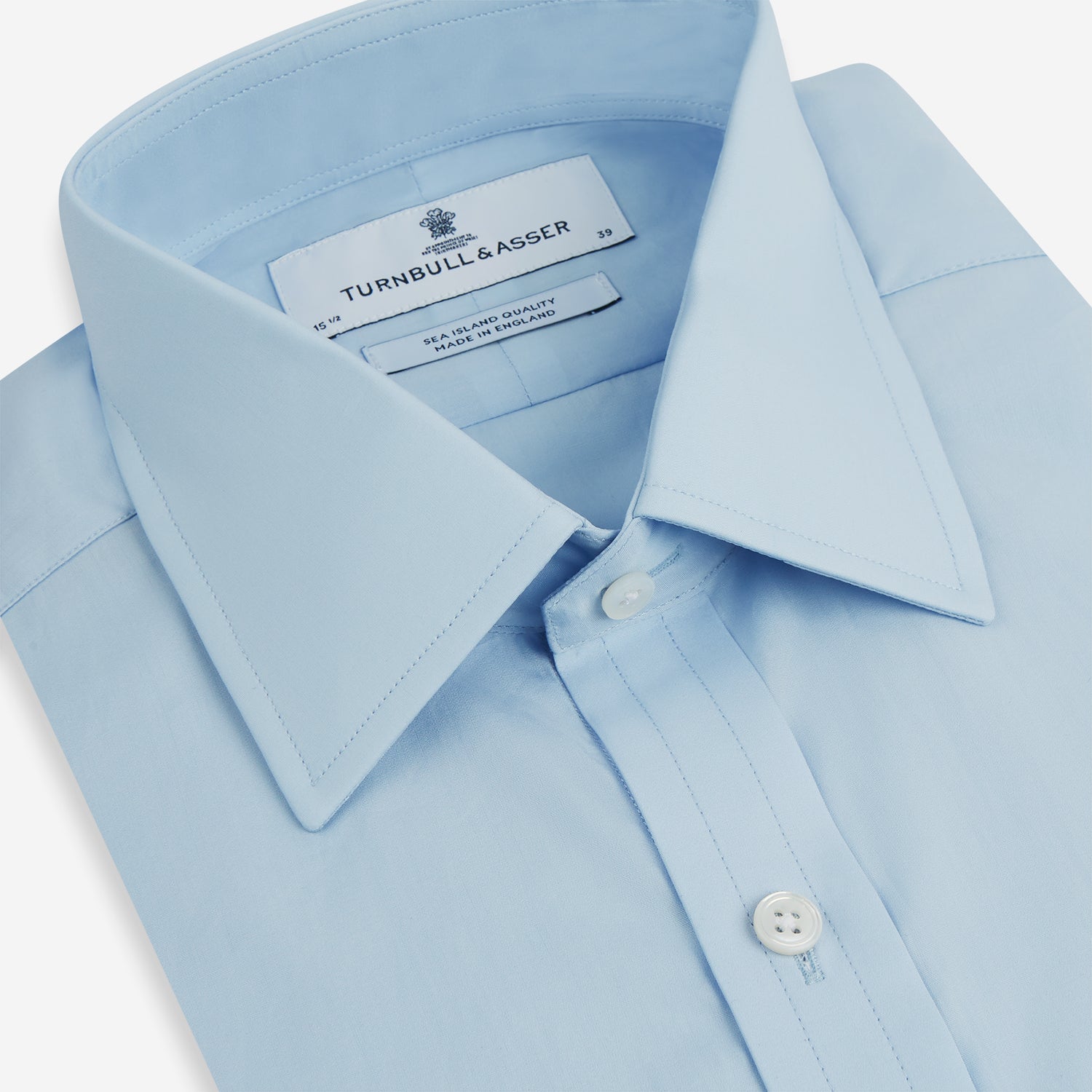 View 2 of product The Turnbull & Asser Light Blue Sea Island Quality Cotton Shirt features a T&A collar, long sleeves, and 3-button cuffs, beautifully displayed flat on a white background.
