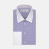 View 1 of product The Wall Street Shirt with White T&A Collar by Turnbull & Asser, as seen on Gordon Gekko, is folded neatly to showcase its light purple color, crisp French cuffs, and iconic contrasting collar against a plain background.