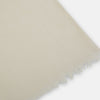 View 2 of product The Turnbull & Asser Rose Cashmere Scarf, in light beige and semi-sheer, is elegantly folded on a white background—an exquisite luxury accessory.