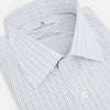 View 2 of product The Turnbull & Asser Pale Blue and Navy Grid Check Mayfair Shirt is a long-sleeve, button-up shirt made from fine Italian cotton, featuring a pointed collar and buttoned cuffs, shown against a plain white background.