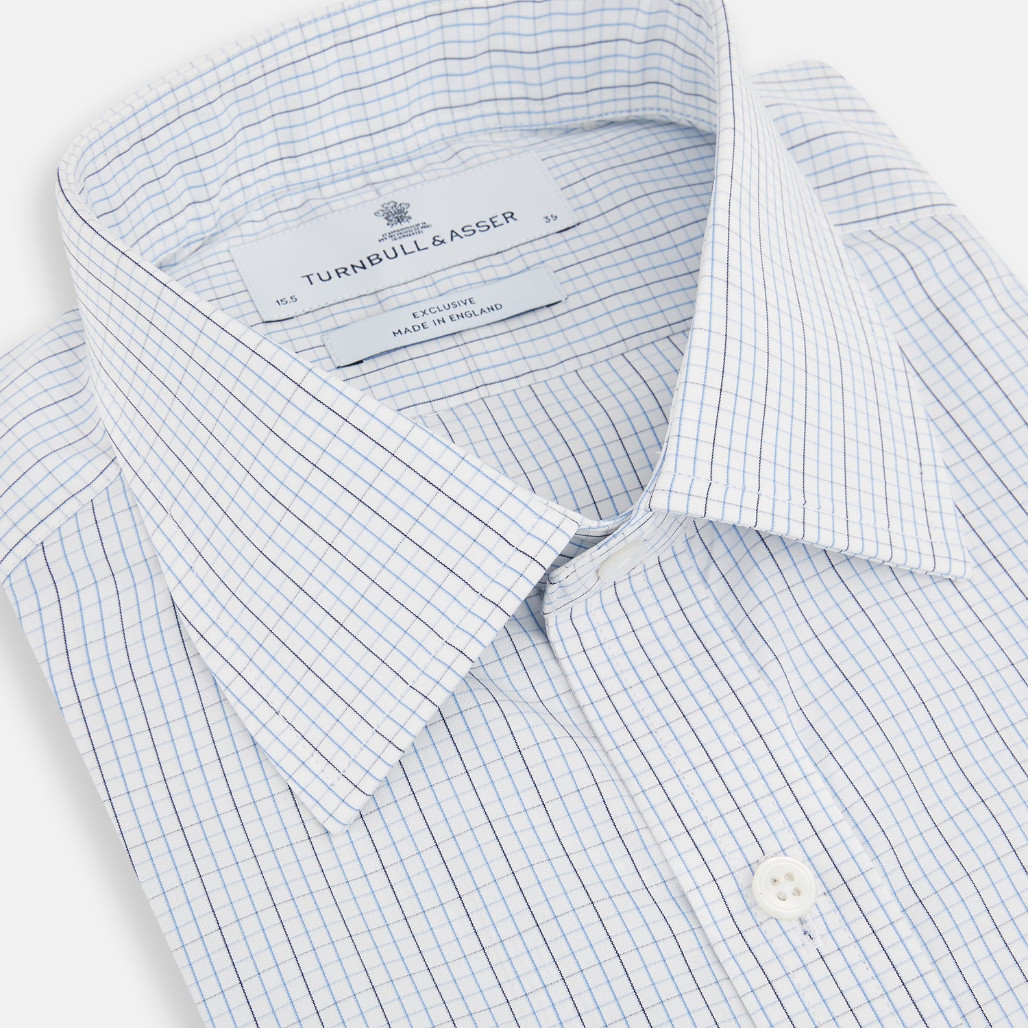 View 2 of product The Turnbull & Asser Pale Blue and Navy Grid Check Mayfair Shirt is a long-sleeve, button-up shirt made from fine Italian cotton, featuring a pointed collar and buttoned cuffs, shown against a plain white background.