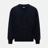 View 1 of product The Navy V-Neck Cashmere Cardigan by Turnbull & Asser features a button-up front, ribbed cuffs and hem, and two front pockets—a classic from our knitwear collection.