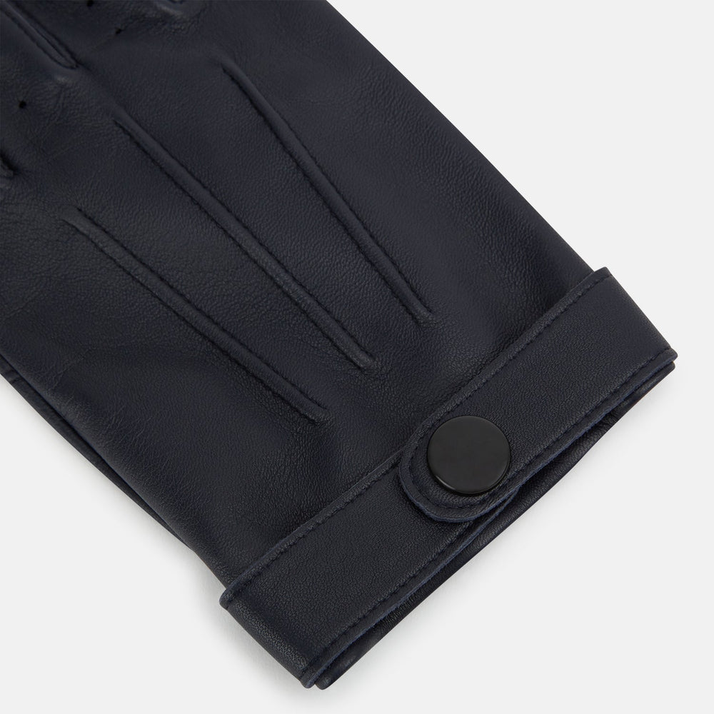 A pair of Navy Hairsheep Leather Touchscreen Driving Gloves by Turnbull & Asser is displayed, one palm up and one palm down. Crafted in Britain, the gloves feature vent holes, decorative stitching, and a snap button closure.