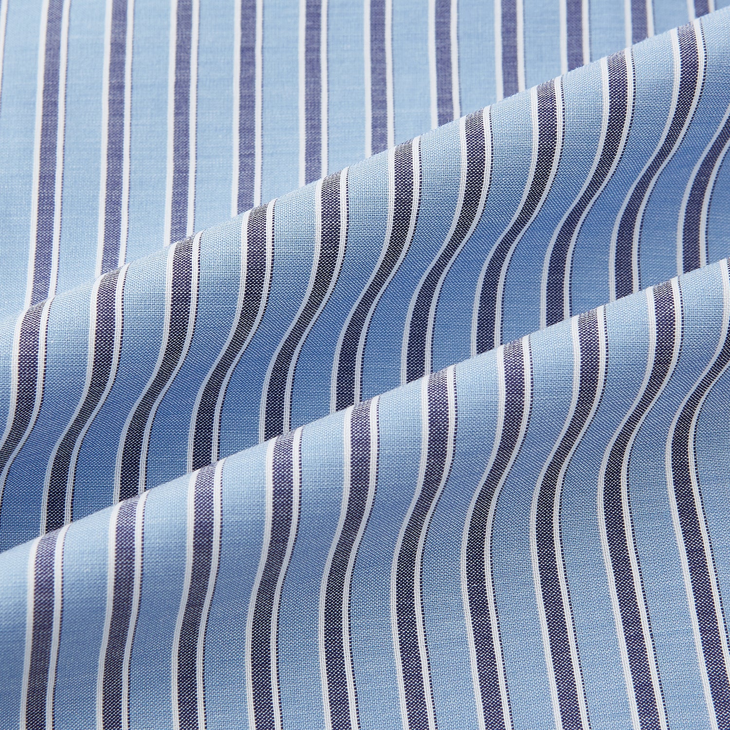 Image 8 of product The Steel Blue Ticking Stripe Westminster Shirt by Turnbull & Asser features a classic fit, Turnbull collar, vertical stripes, white buttons, and buttoned cuffs—showcasing refined British craftsmanship.