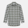 View 2 of product Circular swatch of Turnbull & Asser's Green Check Cotton Fabric, featuring dark green, navy blue, and beige intersecting lines on white, bordered by a gray ring.
