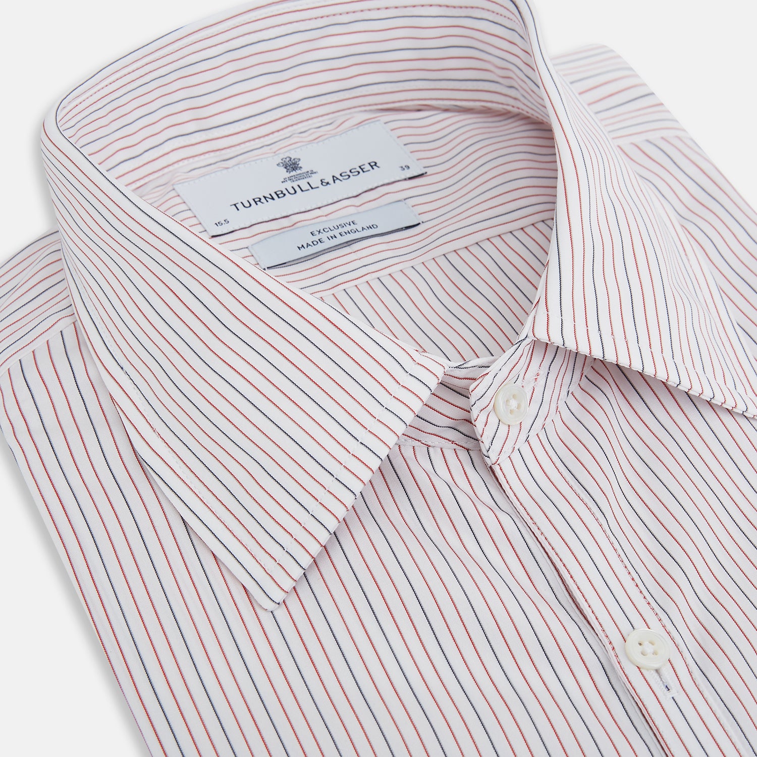 View 2 of product The Turnbull & Asser Red and Blue Ticking Stripe Westminster Shirt features long sleeves, a button-up front, pointed collar, and buttoned cuffs, highlighting British craftsmanship while laid flat on a white background.