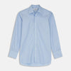 View 2 of product A circular swatch of Pale Blue Check Cotton Fabric by Turnbull & Asser features a small, light blue and white gingham pattern with a thin gray border on a plain white background.