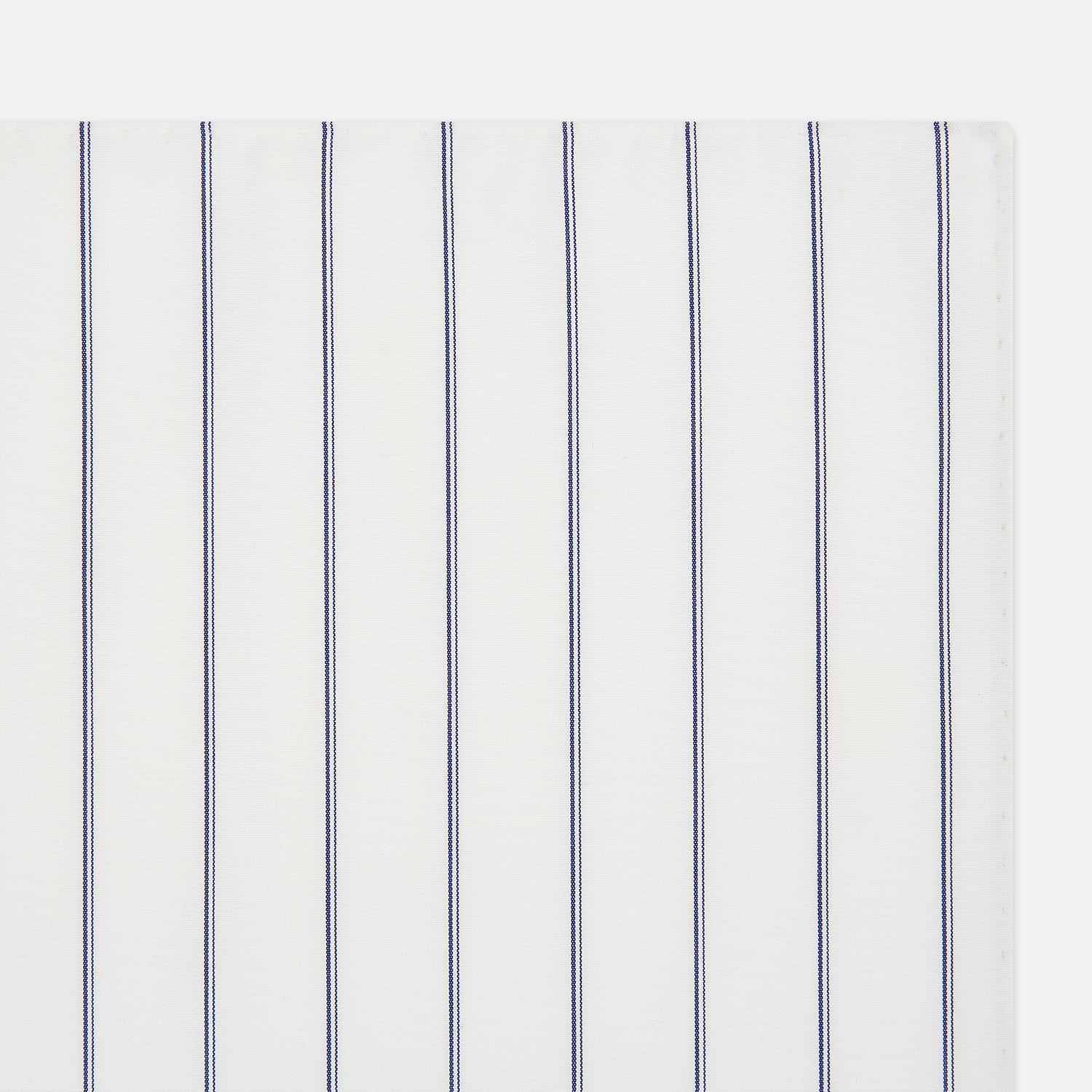 Image 2 of product The Dark Navy Double-Pinstripe Hand-Rolled Handkerchief by Turnbull & Asser features white fabric with evenly spaced thin dark navy stripes and refined hand-rolled edges.