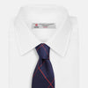 View 2 of product The Turnbull & Asser Red and Navy Window Pane Silk Tie features a refined diagonal red pattern on navy silk, making it an elegant choice for office attire.