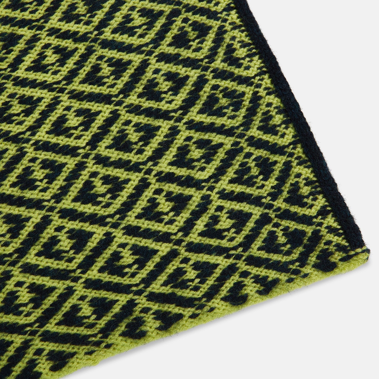 Image 2 of product A Petrol Green and Chartreuse diamond-patterned cashmere knitted scarf by Turnbull & Asser—an essential accessory for adding striking geometric flair to any look.