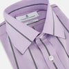 View 2 of product The Turnbull & Asser Lilac Track Stripe Mayfair Shirt is a long-sleeve Italian cotton shirt in light purple with dark lilac vertical stripes, shown laid flat on a white background.