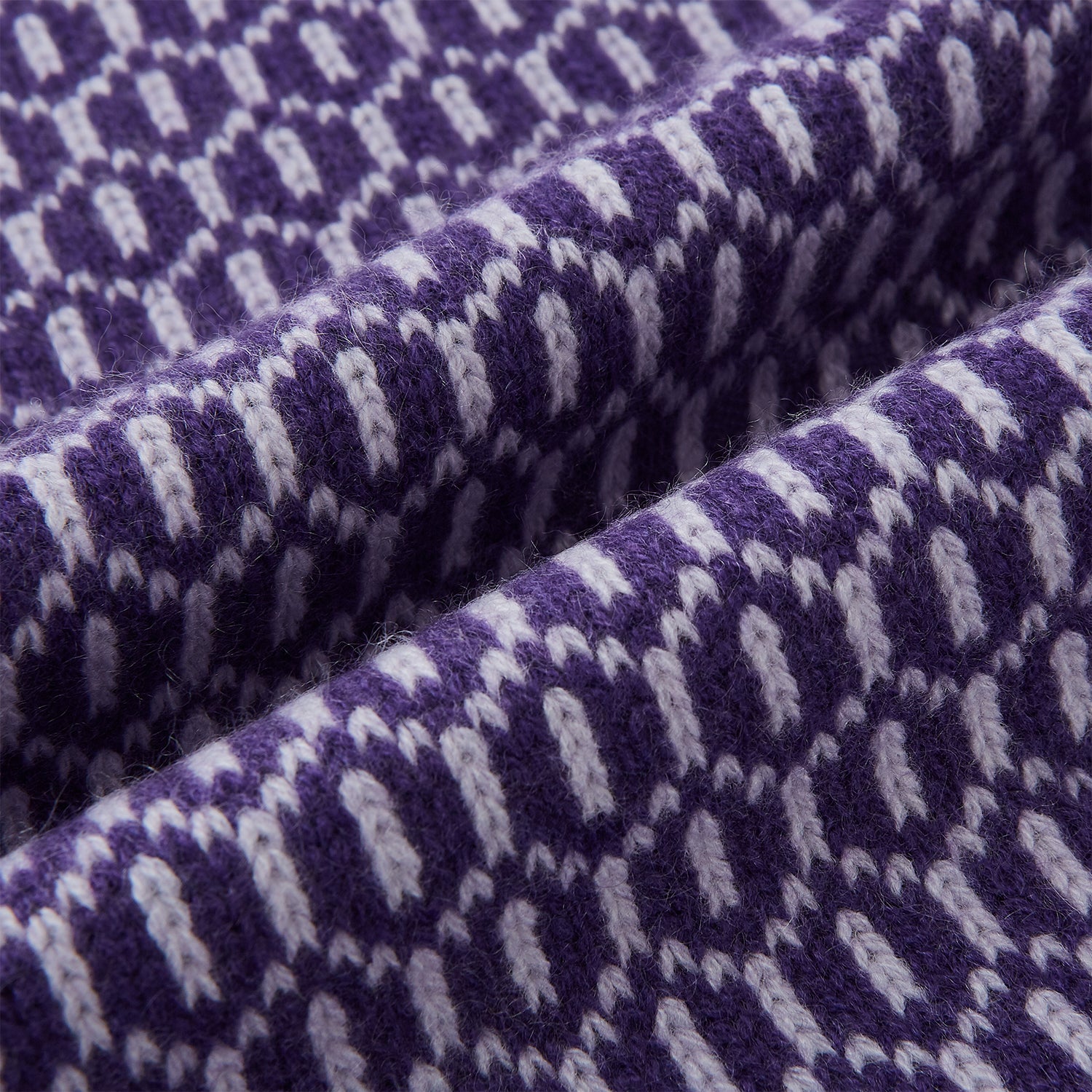 Image 3 of product The Turnbull & Asser Purple and Lilac Hexagon Cashmere Knitted Scarf, featuring a white hexagon pattern, is neatly knotted and displayed on a plain background—a stylish accessory to elevate any outfit.