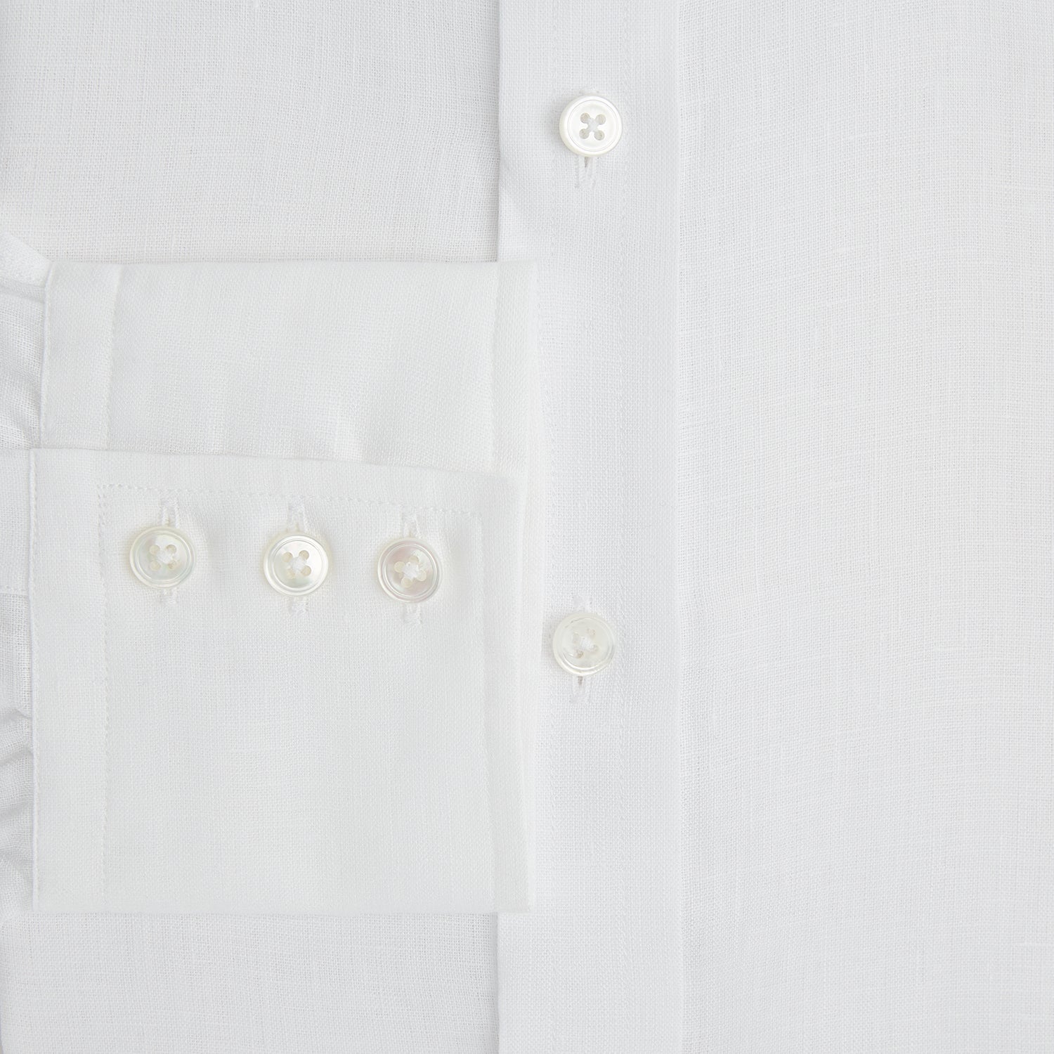 View 4 of product The Turnbull & Asser White Linen Mayfair Shirt features long sleeves and a classic collar, shown on a flat white background.