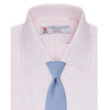 View 4 of product A Pink Herringbone Superfine Cotton Shirt by Turnbull & Asser, featuring a T&A collar and 3-button cuffs, is neatly folded with the inner collar label visible and white buttons, set against a plain white background.