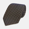 View 1 of product The Turnbull & Asser White and Brown Micro Dot Silk Tie features a refined micro dot pattern—an essential accessory for any men's wardrobe.