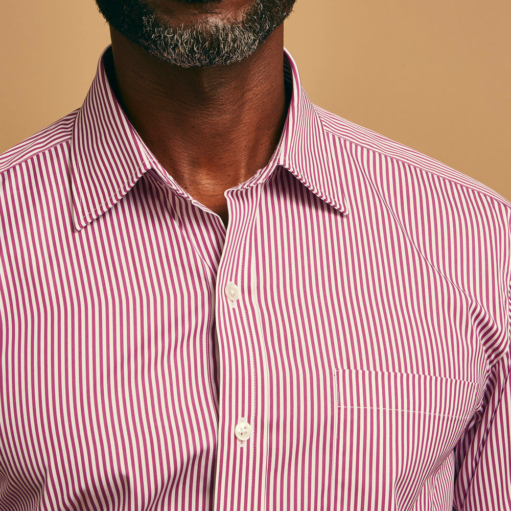 The Turnbull & Asser Purple & White Stripe Weekend Fit Shirt features a Derby collar, chest pocket, and 1-button cuffs—ideal for casual weekends.