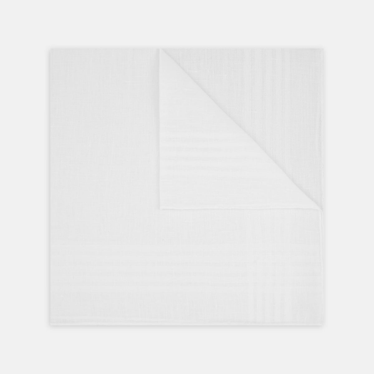 View 1 of product A White Cross Stripe Hand-Rolled Linen Handkerchief by Turnbull & Asser UK, artfully folded with one corner turned down, is displayed on a plain white background, evoking the elegant look of a classic pocket square.