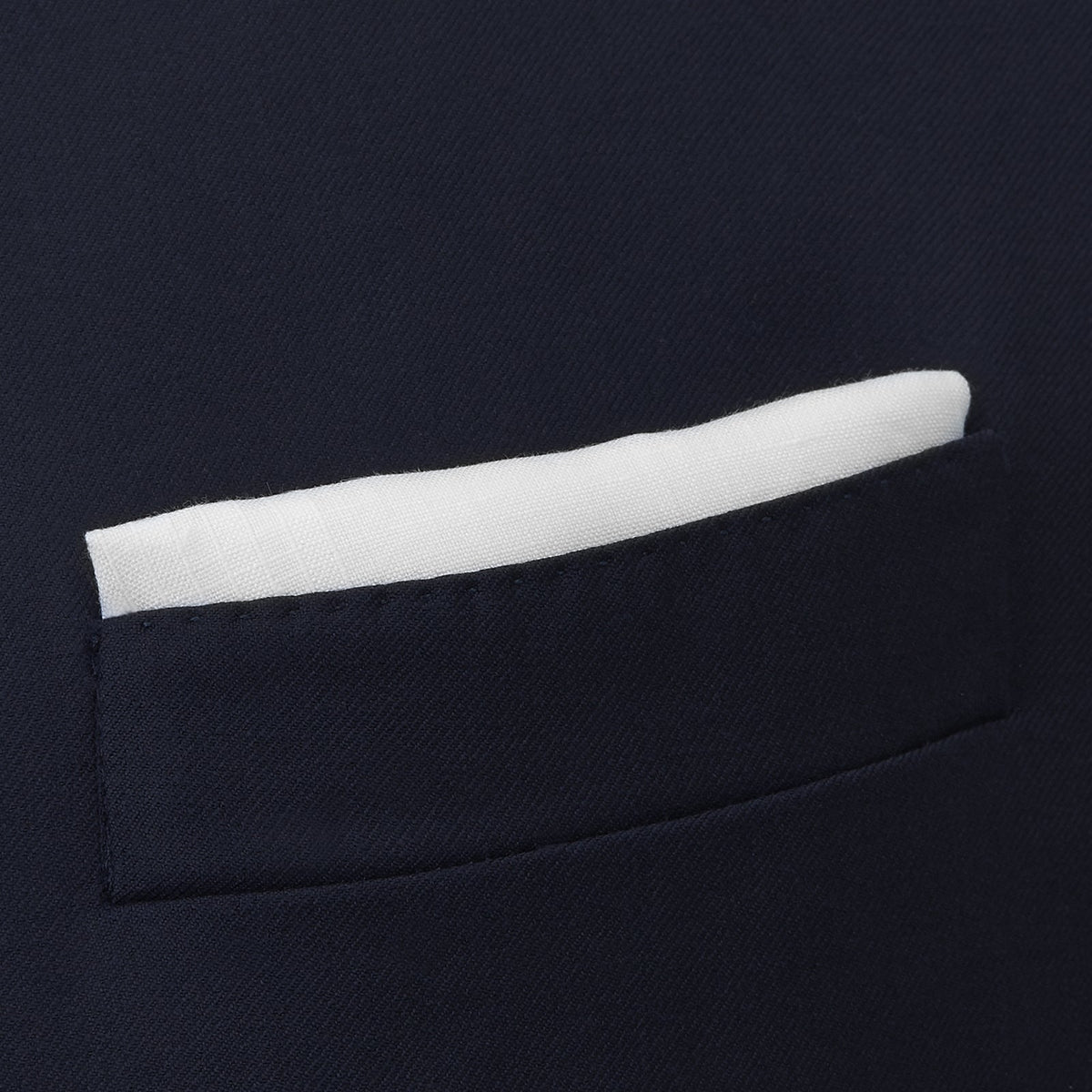 View 4 of product A White Cross Stripe Hand-Rolled Linen Handkerchief by Turnbull & Asser UK, artfully folded with one corner turned down, is displayed on a plain white background, evoking the elegant look of a classic pocket square.