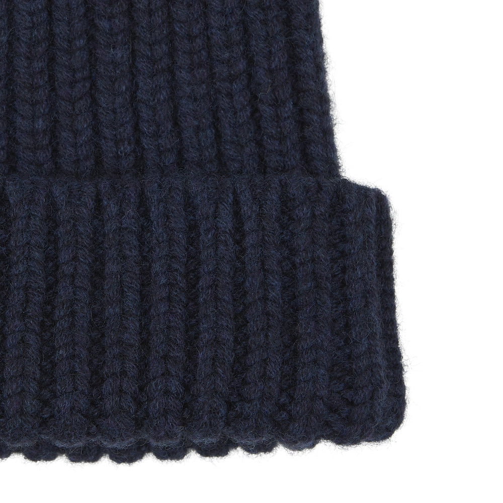 The Turnbull & Asser Navy Ribbed Cashmere Hat features a folded brim and is displayed on a plain white background.