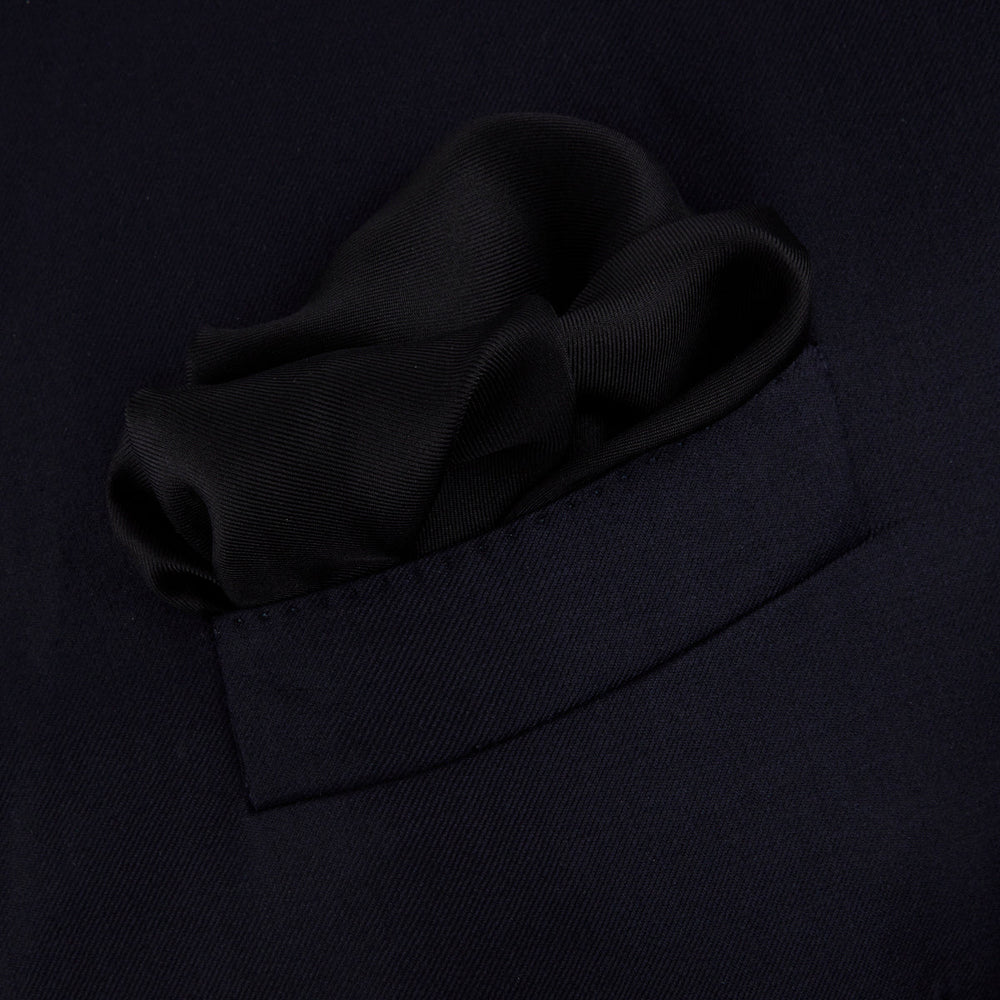 Add a touch of elegance with Turnbull & Asser’s Black and White Piped Silk Pocket Square, featuring white piping on one edge and the brand’s embroidered logo in white for a refined, classic look.