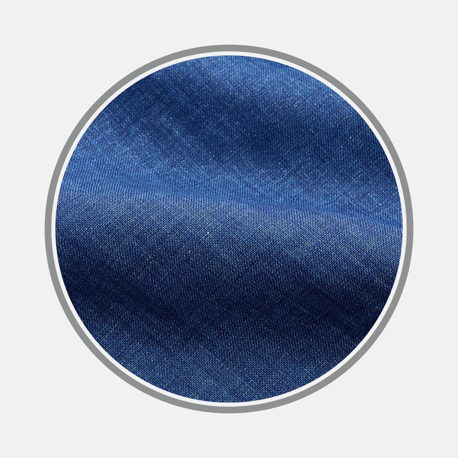 View 1 of product Close-up of BESPOKE FABRIC 0017 05 by Turnbull & Asser—blue denim fabric with visible weave texture and subtle diagonal lines, framed in a circular border on a white background.