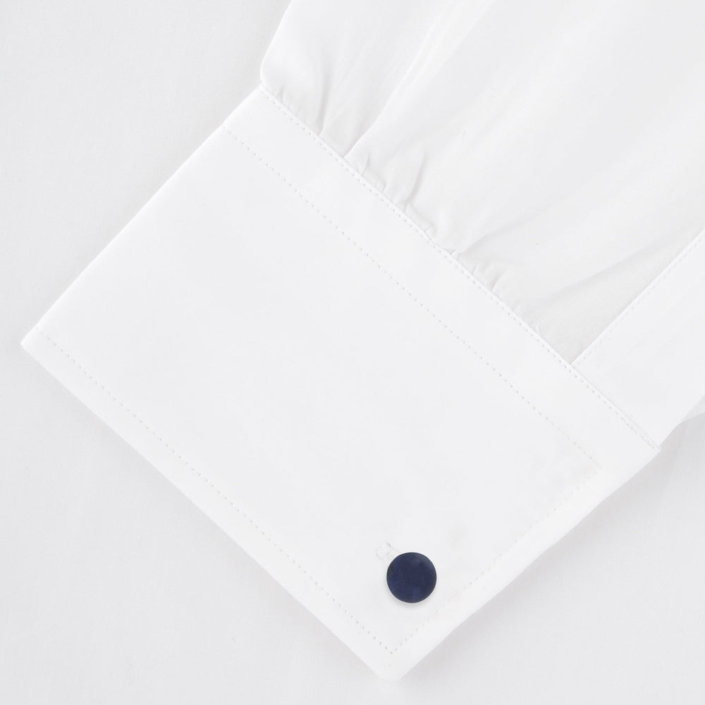 Turnbull & Asser's Sterling Silver Ornament Cufflinks feature round, textured ridged ends and smooth, flat backs, presented elegantly on a plain white background.