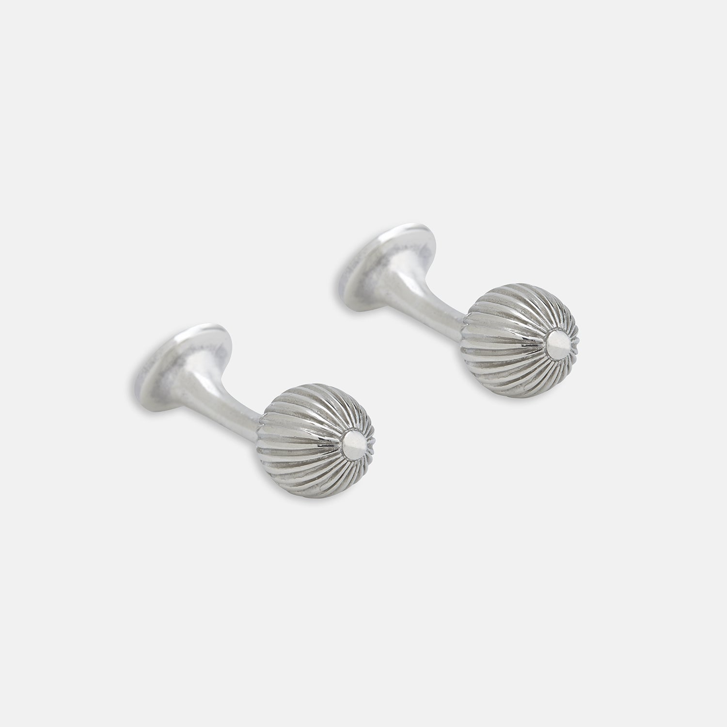 View 1 of product Turnbull & Asser's Sterling Silver Ornament Cufflinks feature round, textured ridged ends and smooth, flat backs, presented elegantly on a plain white background.