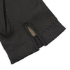 View 2 of product The Walden Black Leather Gloves by Turnbull & Asser, crafted from hairsheep leather with decorative stitching, are shown overlapping on a white background—an elegant showcase of timeless luxury and refined style.