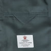 View 2 of product The Turnbull & Asser Green Double Breasted Velvet Smoking Jacket features a shawl collar, frog closures, and trim detailing on the cuffs and edges, shown against a white background—a sophisticated piece of eveningwear.