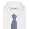View 2 of product The Turnbull & Asser Blue Houndstooth Silk Tie features a classic blue and white pattern, rolled and displayed on a white background—an elegant accessory for your favorite office shirt.