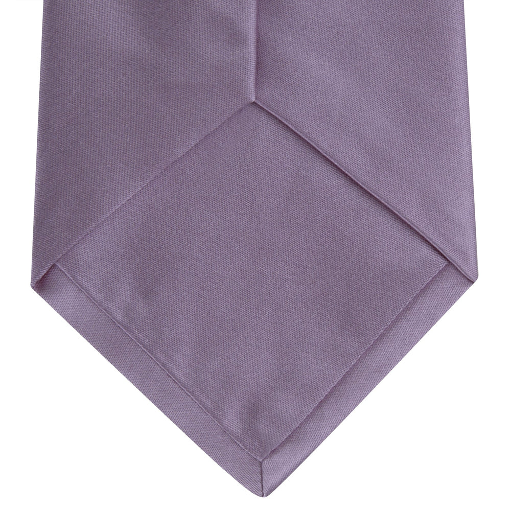 The Turnbull & Asser Lilac Plain Satin Silk Tie, featuring a smooth finish, is neatly rolled and displayed on a white background—a classic accessory for any versatile wardrobe.