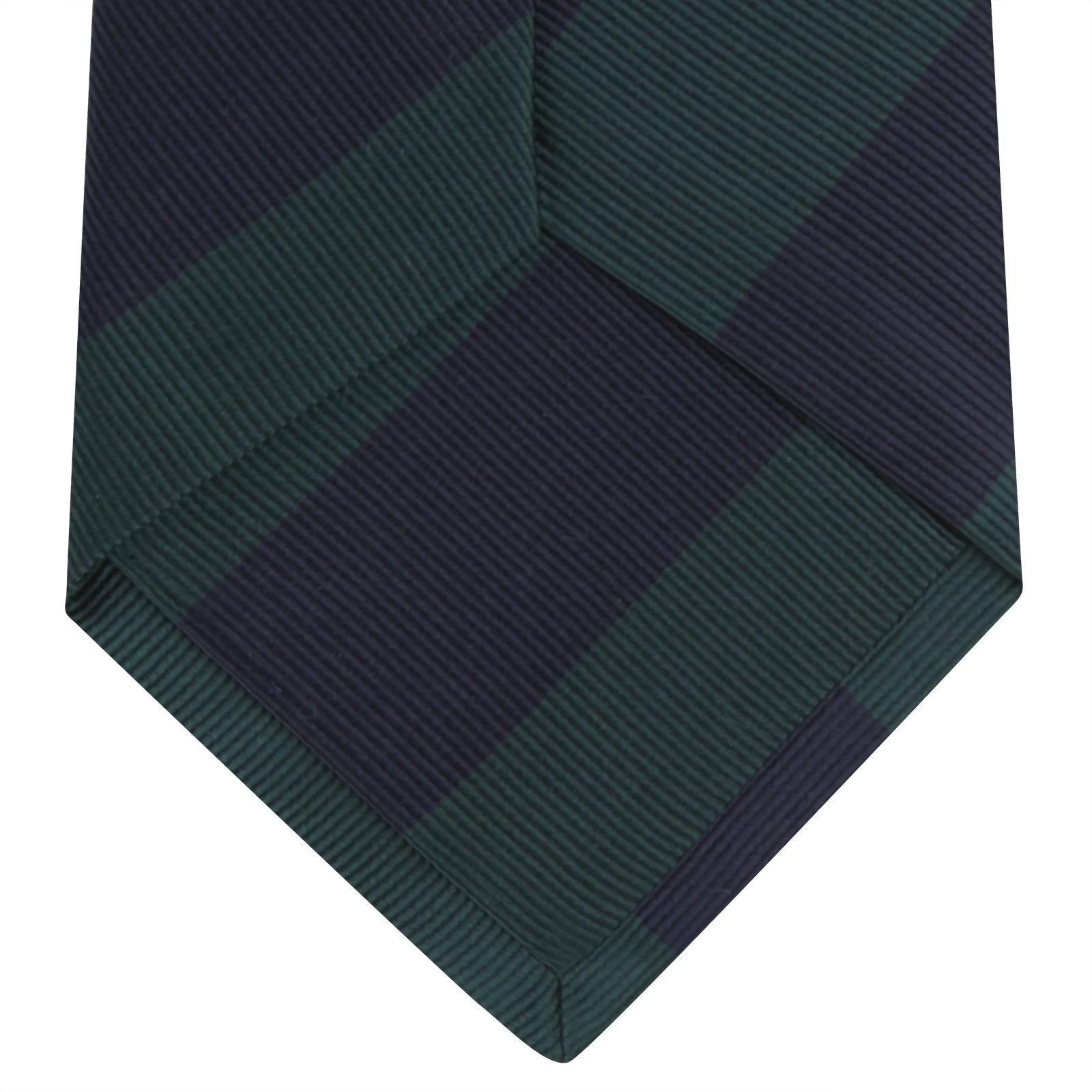 View 4 of product The Turnbull & Asser Navy and Forest Green Block Stripe Repp Silk Tie features bold stripes and is expertly crafted from luxurious silk, shown rolled on a white background.