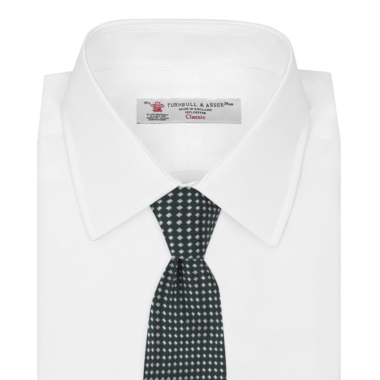 View 2 of product The Turnbull & Asser Forest Green and White Diamond Silk Tie features a geometric pattern of small, evenly spaced white diamonds on a forest green background, displayed rolled up on a white surface.