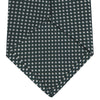 View 4 of product The Turnbull & Asser Forest Green and White Diamond Silk Tie features a geometric pattern of small, evenly spaced white diamonds on a forest green background, displayed rolled up on a white surface.