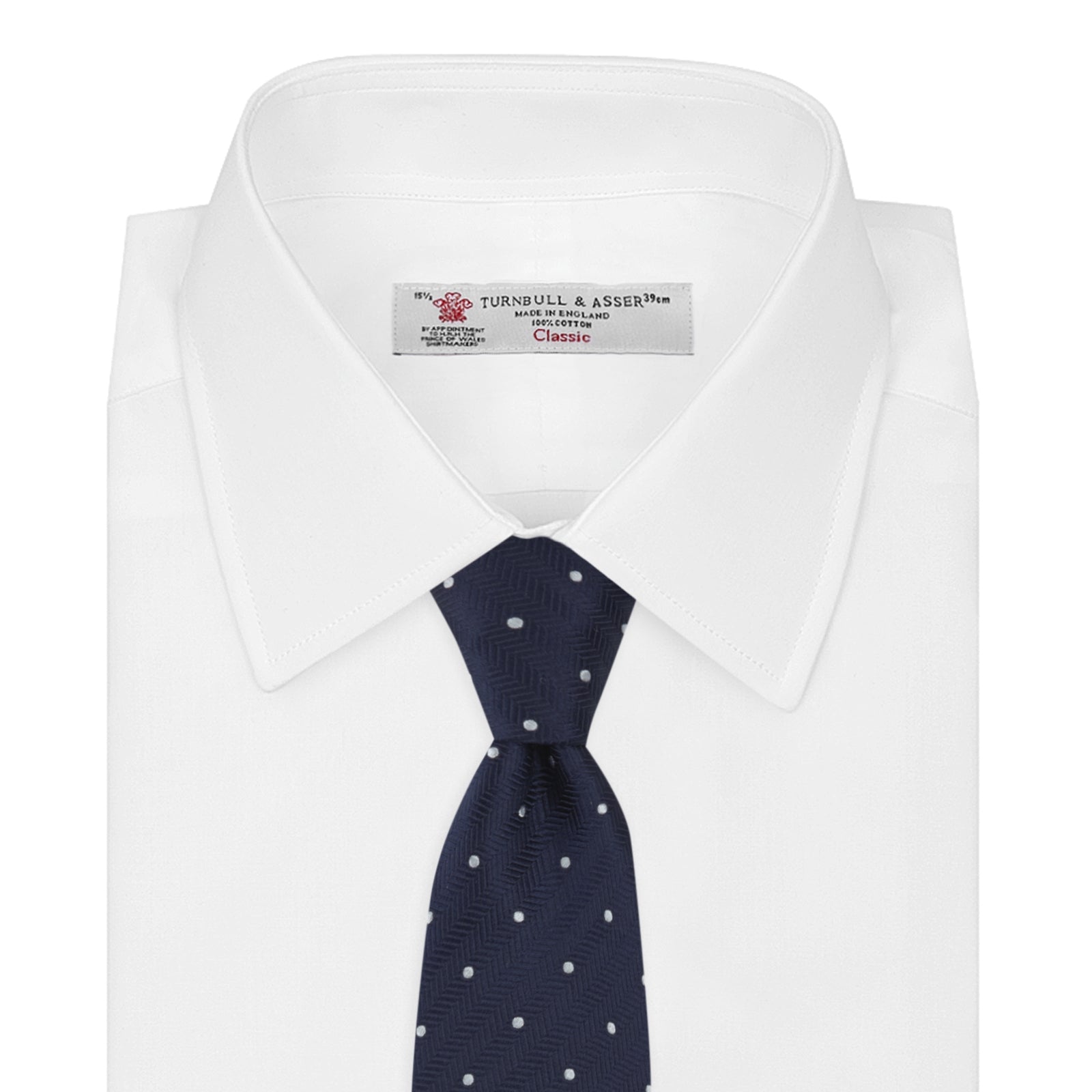 View 2 of product The Navy and White Small Spot Herringbone Silk Tie from Turnbull & Asser features a classic navy herringbone pattern with small white polka dots, offering an elegant look suitable for any occasion.