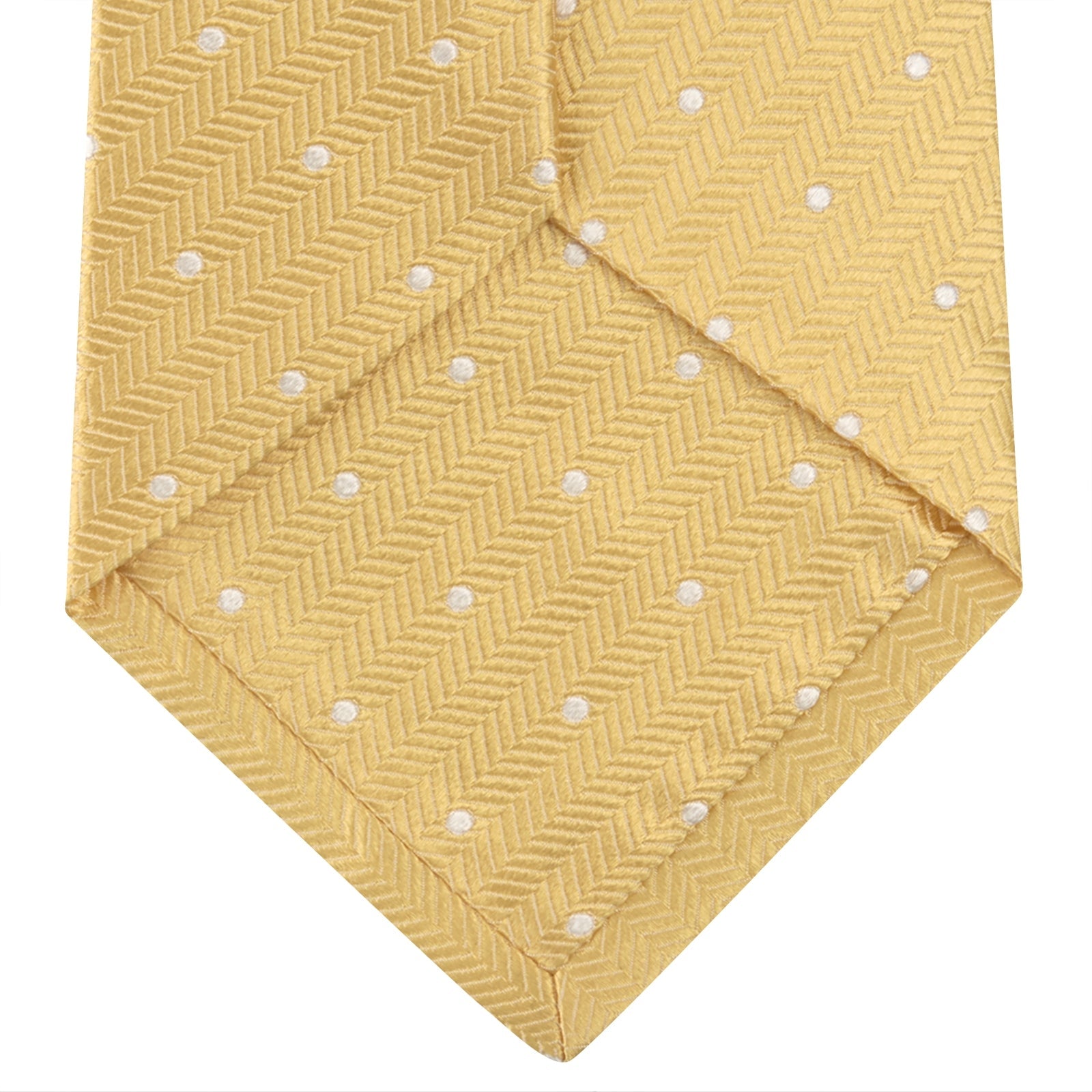 View 4 of product The Turnbull & Asser Gold and White Small Spot Herringbone Silk Tie is crafted from fine English silk, featuring a gold herringbone weave with white polka dots, and is shown rolled up on a white background.