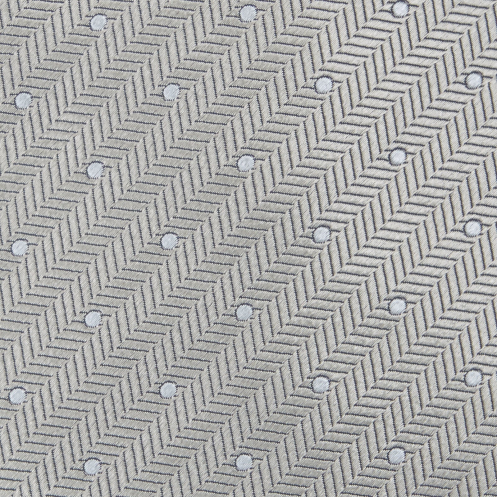 View 3 of product The Turnbull & Asser Silver and White Small Spot Herringbone Silk Tie features a subtle pattern of small, evenly spaced light dots and is expertly crafted from fine English silk.